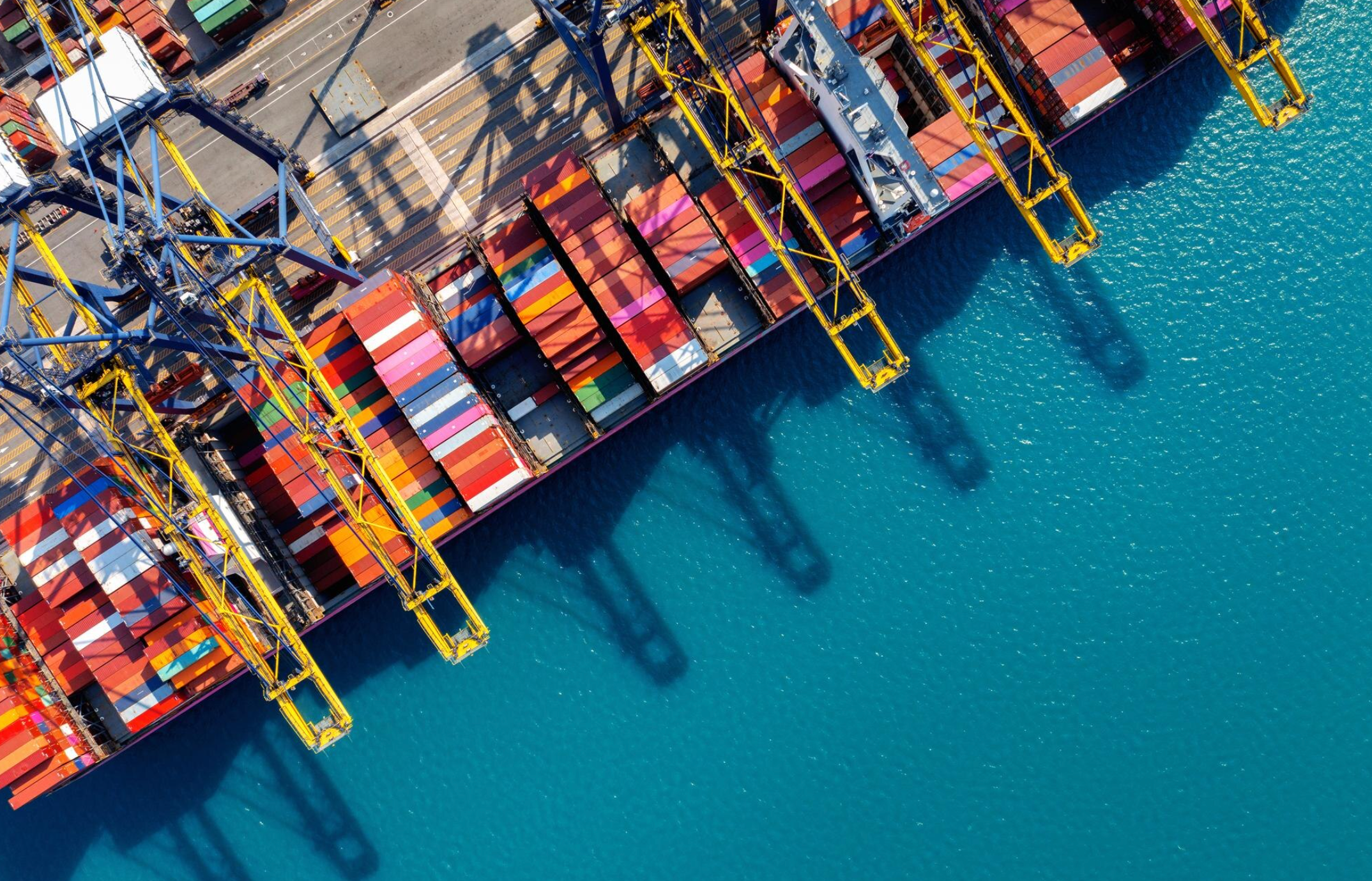 Aerial view of a shipping port — IEEPA tariff refund recovery specialists