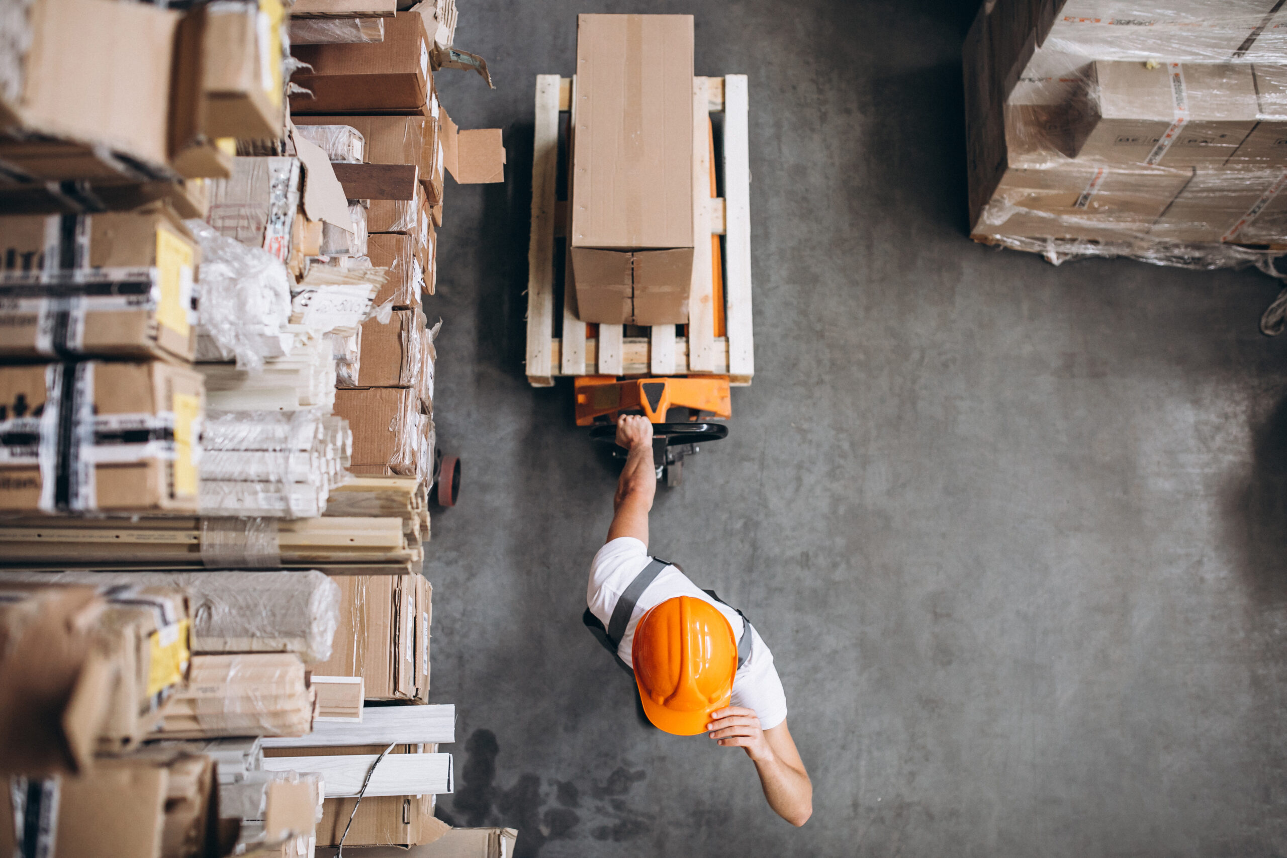 Warehouse worker managing import cargo — TTM International IEEPA refund recovery services